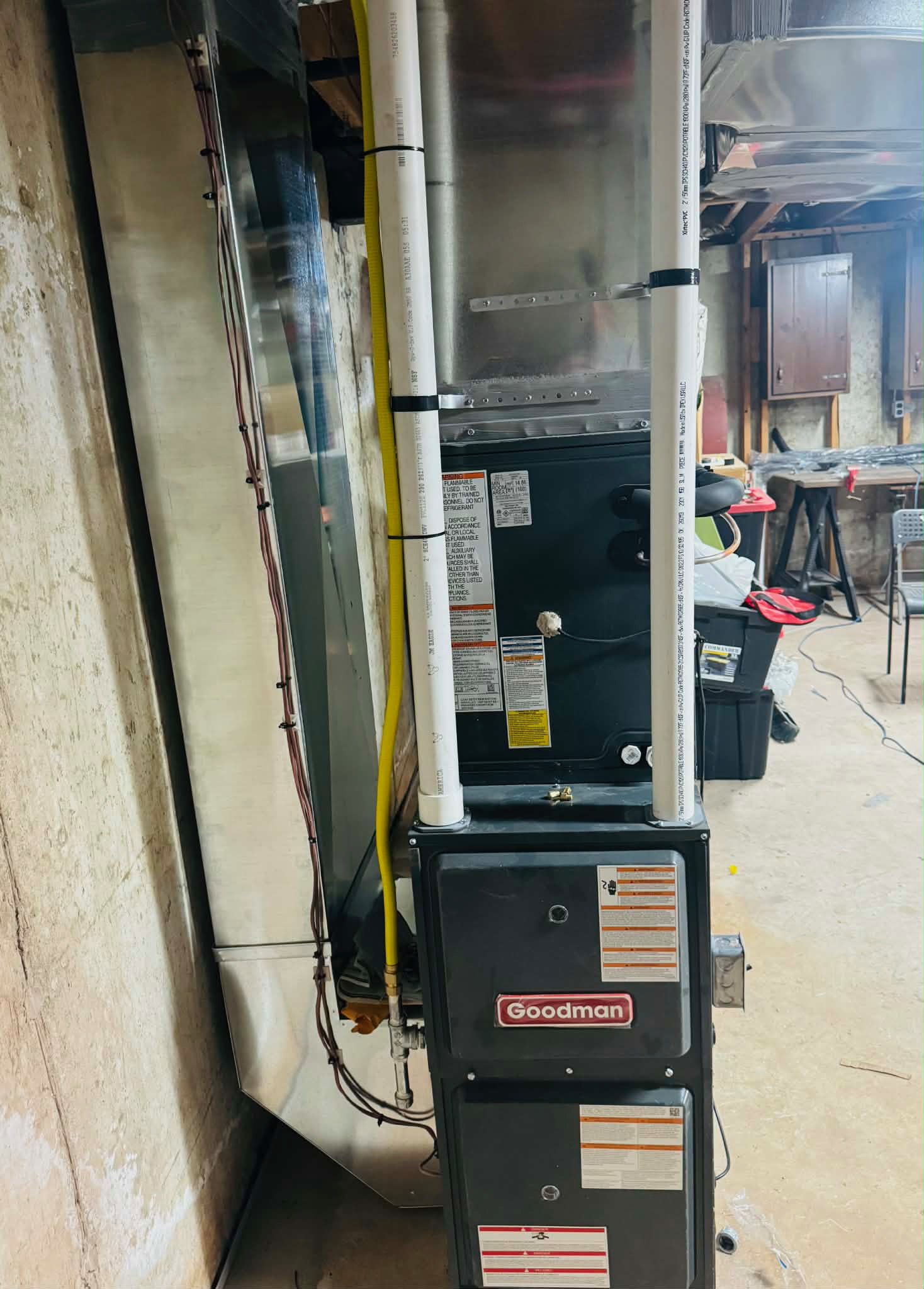 High-efficiency gas furnace install with PVC venting and clean piping